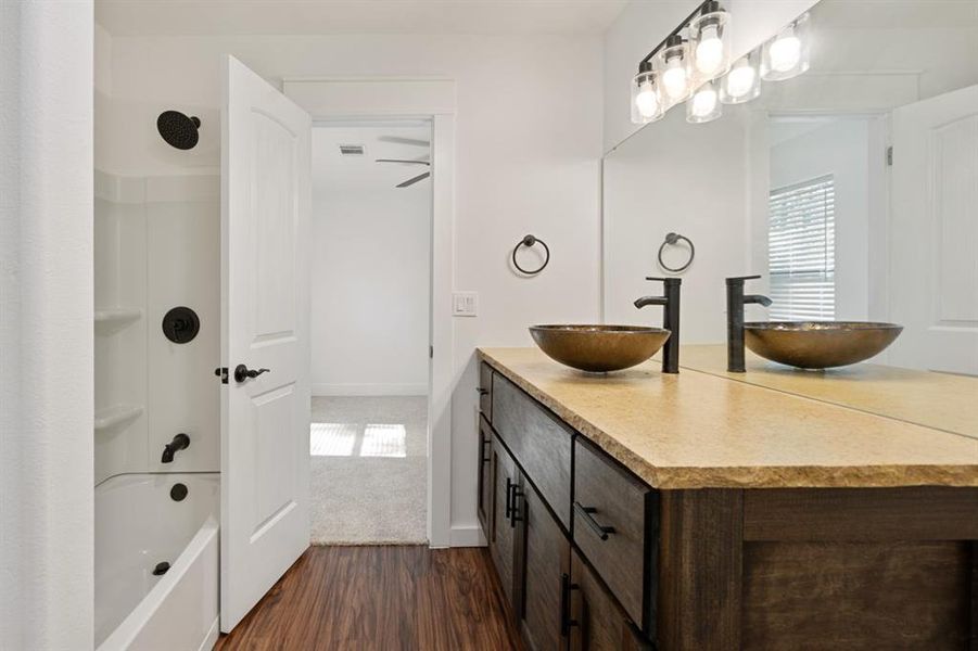 Bathroom featuring wood-type flooring and vanity