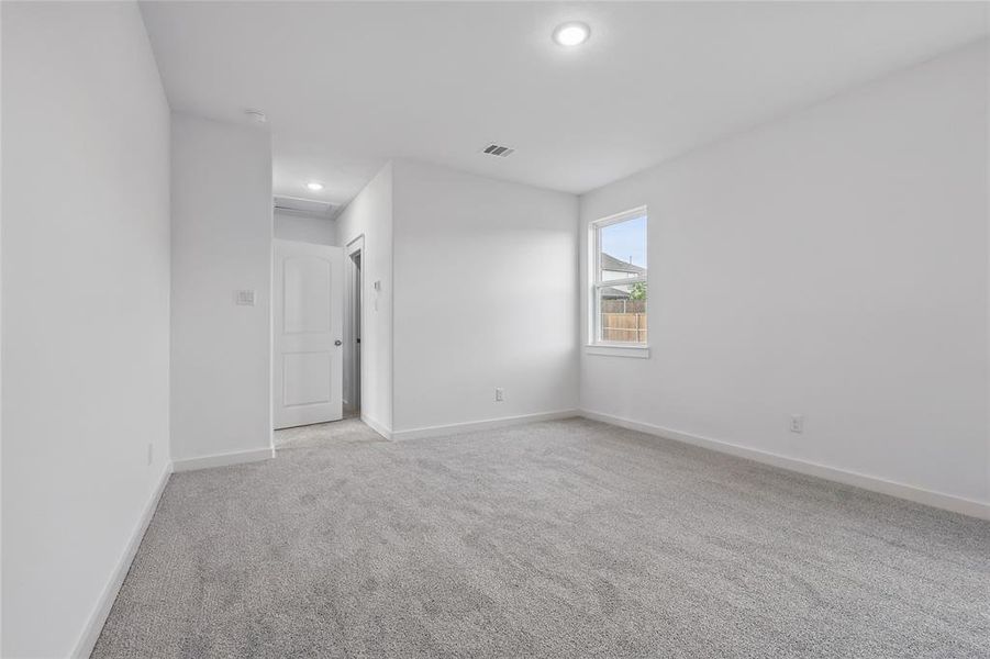 Unfurnished room with light carpet and recessed lighting
