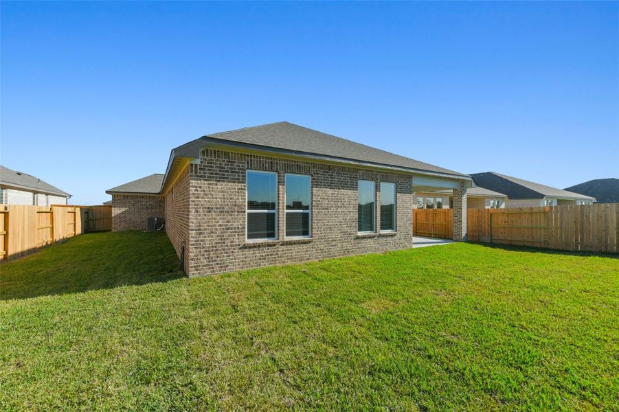 Front exterior of a new home in Lago Mar, La Marque, TX, highlighting curb appeal (Image 23).