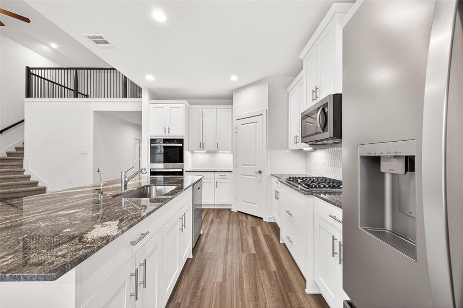 Furnished interior view inside a new home in Harvest Green, Richmond (Image 5).