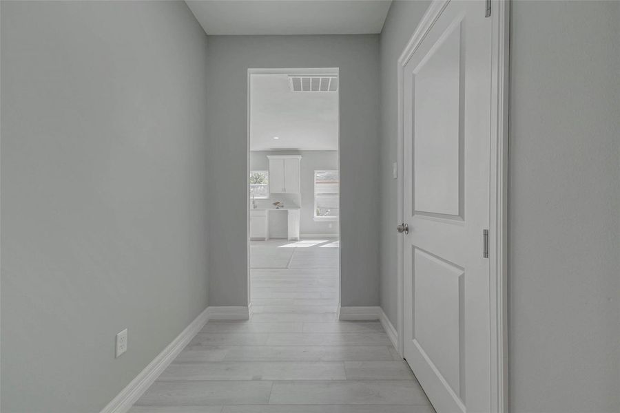 Entrance from garage with a mud area space.