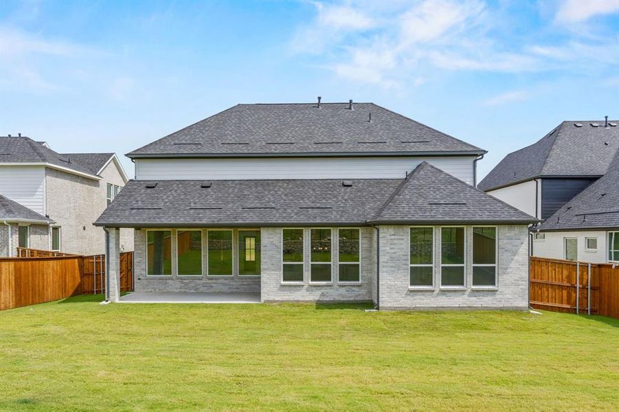 Exterior details and patio area of a home in Chatham Reserve, Providence Village (Image 3).