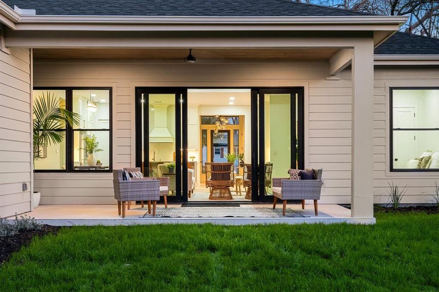 Step outside to the large backyard, complete with a covered patio, offering space for customization and relaxation