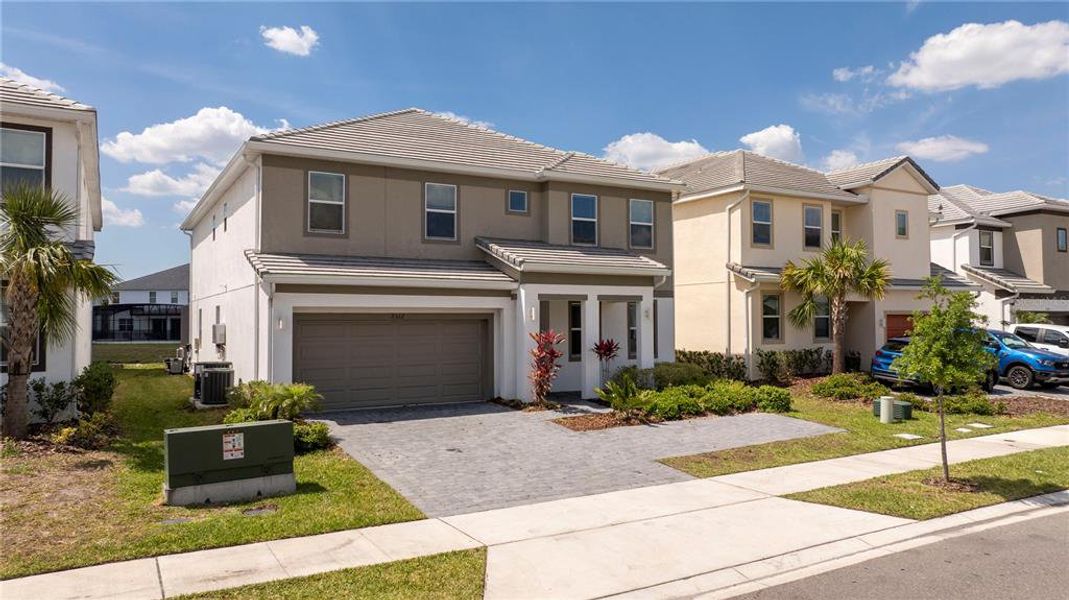 Front exterior of a new home in , Kissimmee, FL, highlighting curb appeal (Image 19). Front exterior of a new home in , Kissimmee, FL, highlighting curb appeal (Image 19).