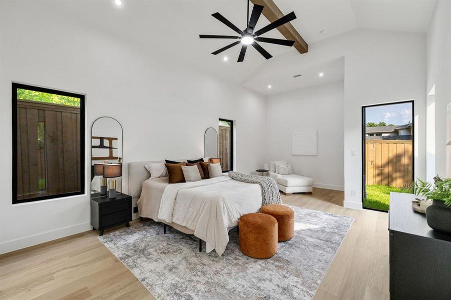 Vaulted ceilings with an exposed wood beam and modern ceiling fan