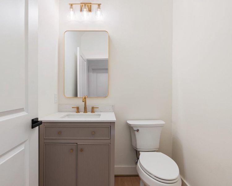 The first-floor half bathroom features elegant finishes and a clean, stylish design—perfect for guests and everyday convenience. The first-floor half bathroom features elegant finishes and a clean, stylish design—perfect for guests and everyday convenience.