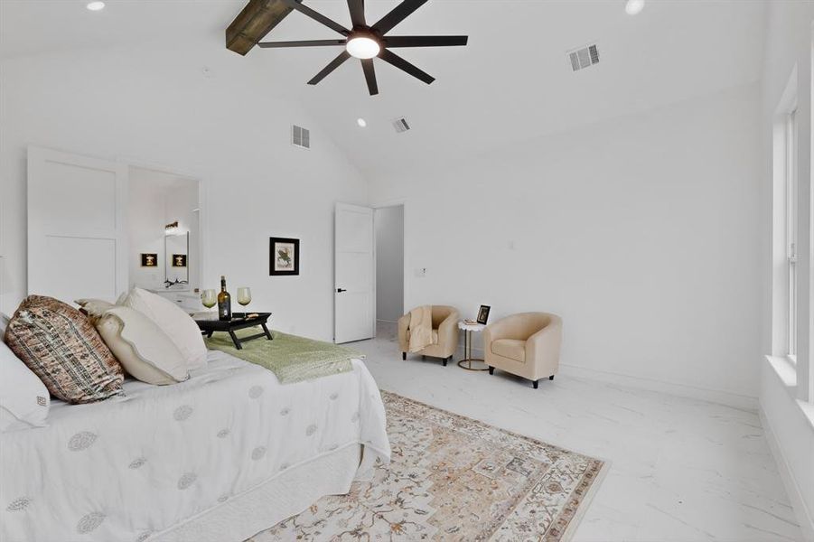 Spacious room featuring vaulted ceilings, recessed lighting, a contemporary ceiling fan with a wood-finish beam, light-toned tile flooring, and a large window providing natural light