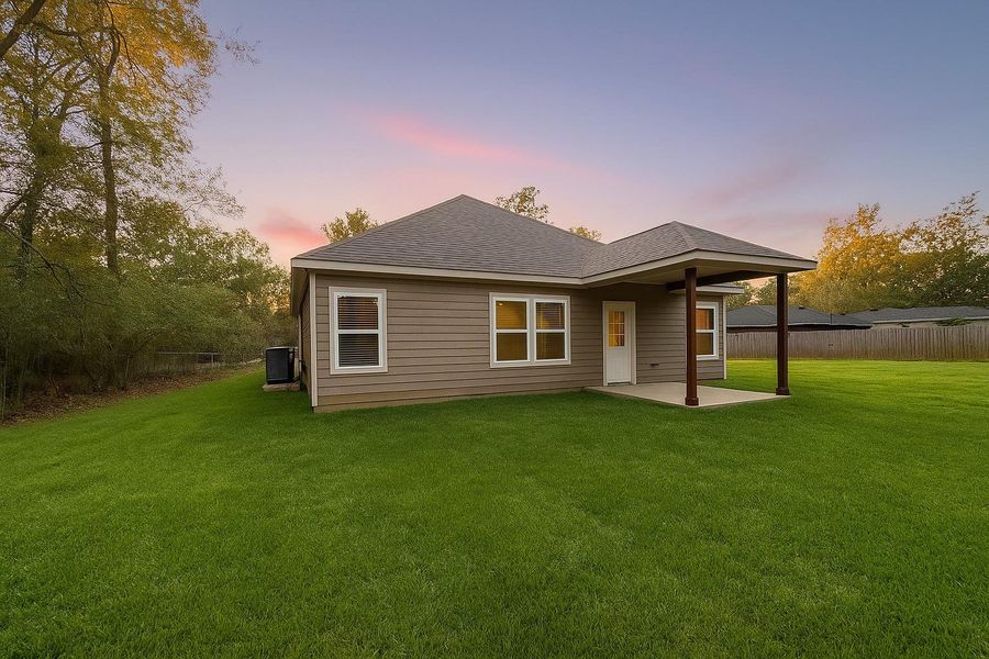 Backyard features covered patio