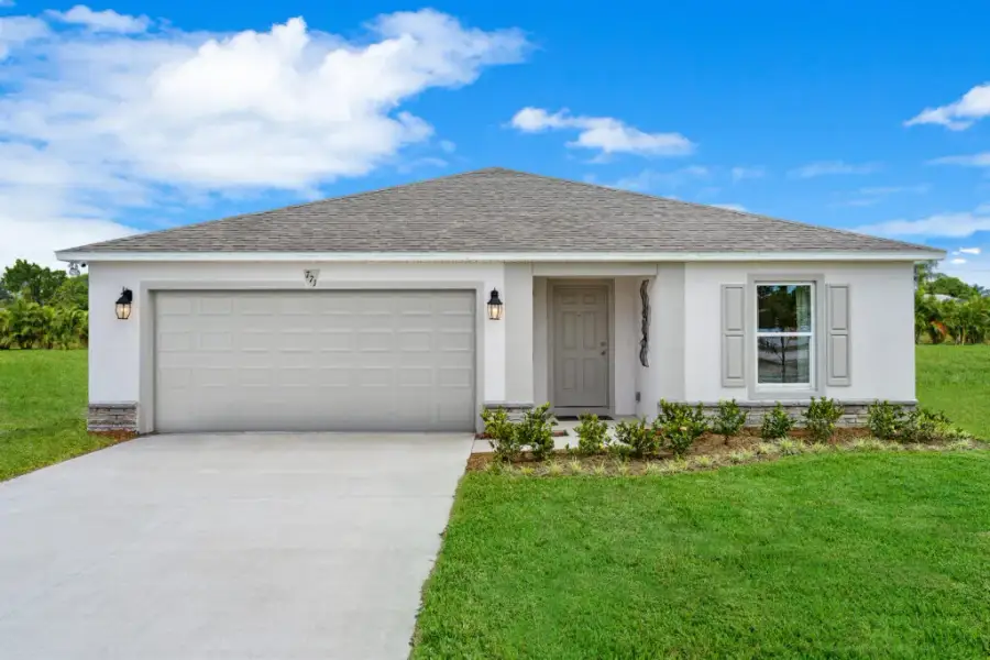 Front exterior of a new home in North Port, North Port, FL, highlighting curb appeal (Image 1). Front exterior of a new home in North Port, North Port, FL, highlighting curb appeal (Image 1).