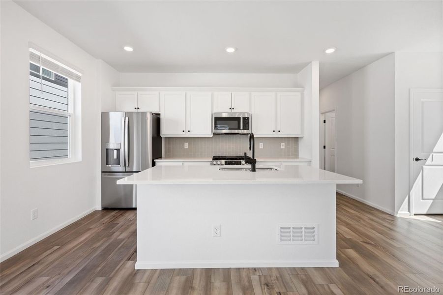 Furnished interior view inside a new home in Woodrose at Painted Prairie, Aurora (Image 11).