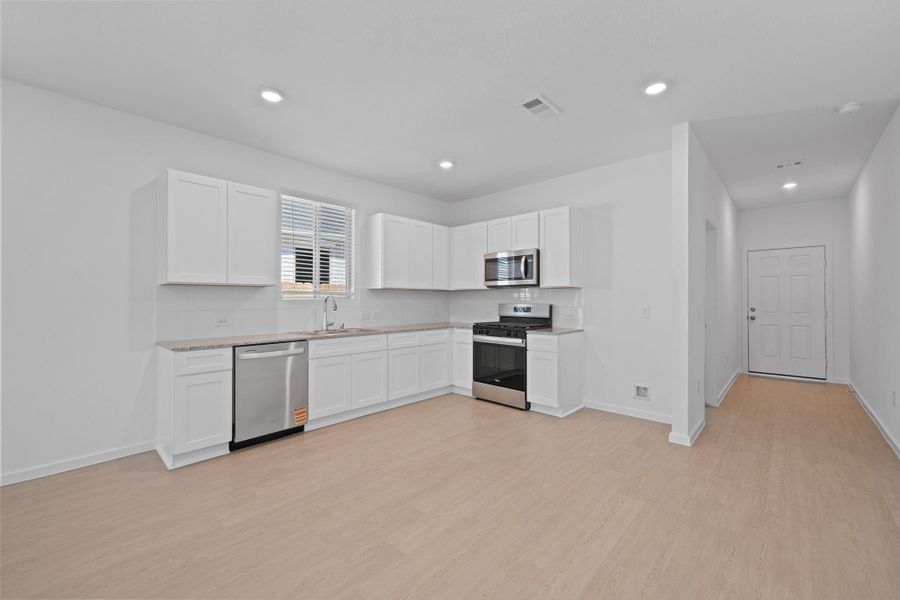 Furnished interior view inside a new home in Crosby Farms, Crosby (Image 6).