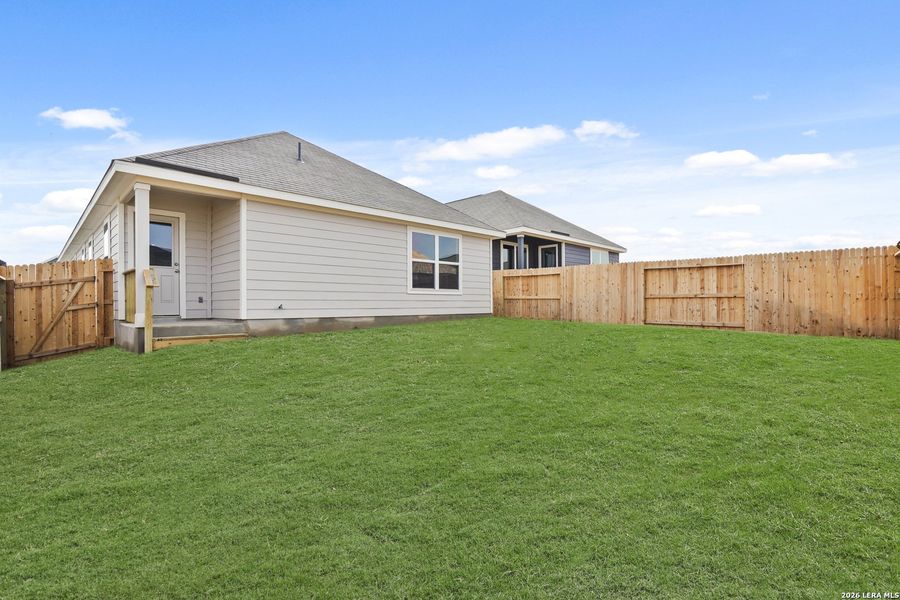 Exterior details and patio area of a home in Hickory Ridge, Elmendorf (Image 3).