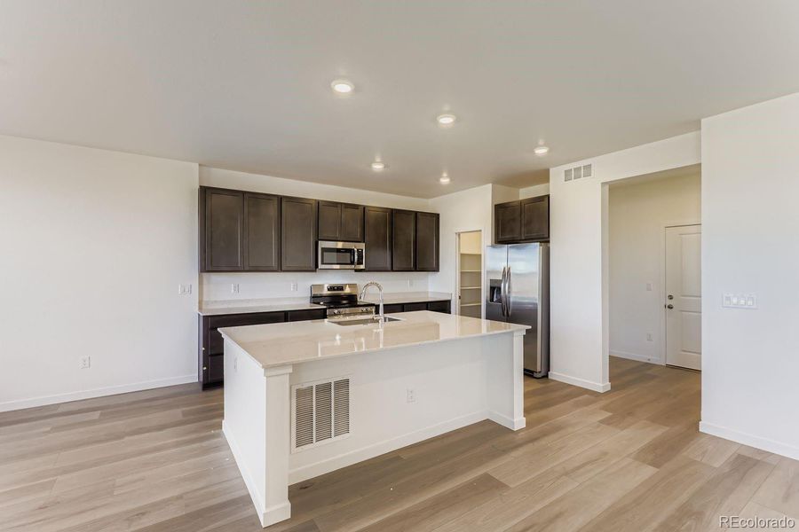 Furnished interior view inside a new home in Parterre, Thornton (Image 5).