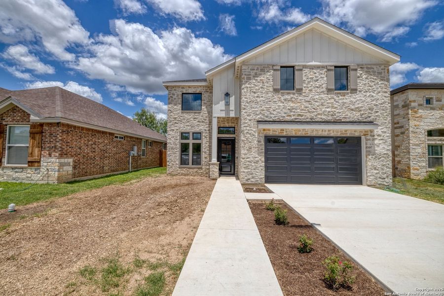 Front exterior of a new home in , Uvalde, TX, highlighting curb appeal (Image 17).