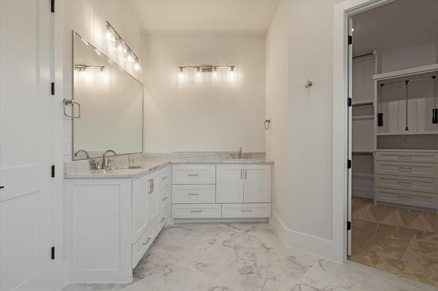 Bathroom featuring vanity and tile floors