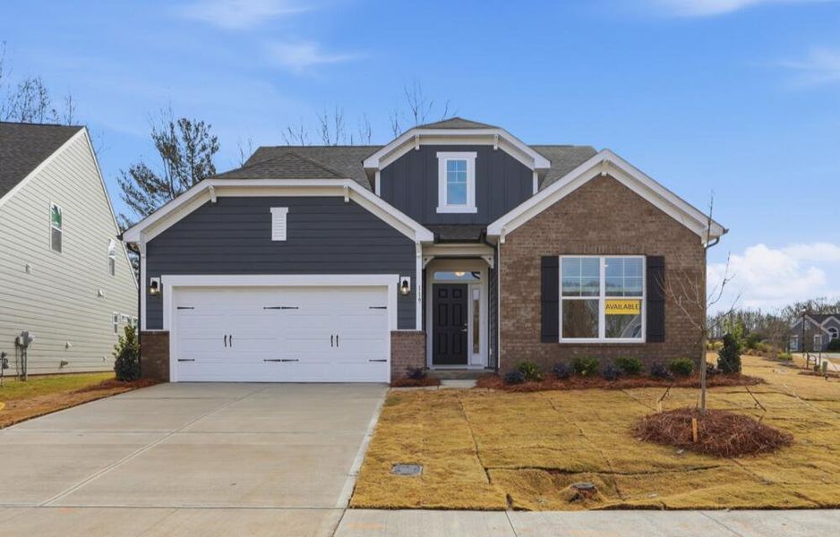 Front exterior of a new home in Villas at Prestwick, Mooresville, NC, highlighting curb appeal (Image 2). Front exterior of a new home in Villas at Prestwick, Mooresville, NC, highlighting curb appeal (Image 2).