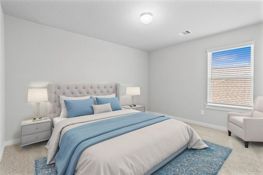 Secondary bedroom features plush carpet, neutral paint and a large window with privacy blinds.