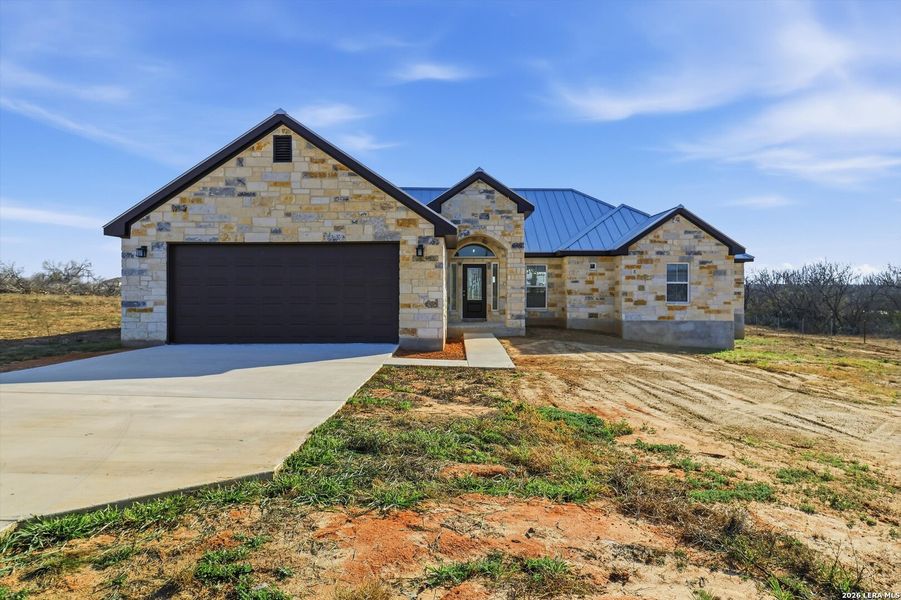 Front exterior of a new home in , St. Hedwig, TX, highlighting curb appeal (Image 29). Front exterior of a new home in , St. Hedwig, TX, highlighting curb appeal (Image 29).