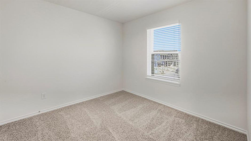 Spare room with carpet floors and baseboards