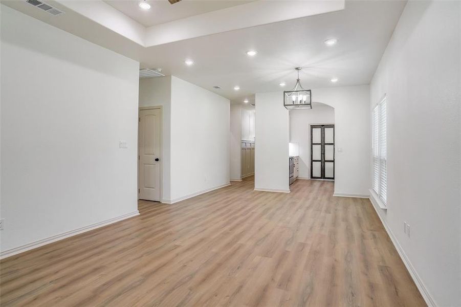 Empty room with light hardwood / wood-style flooring