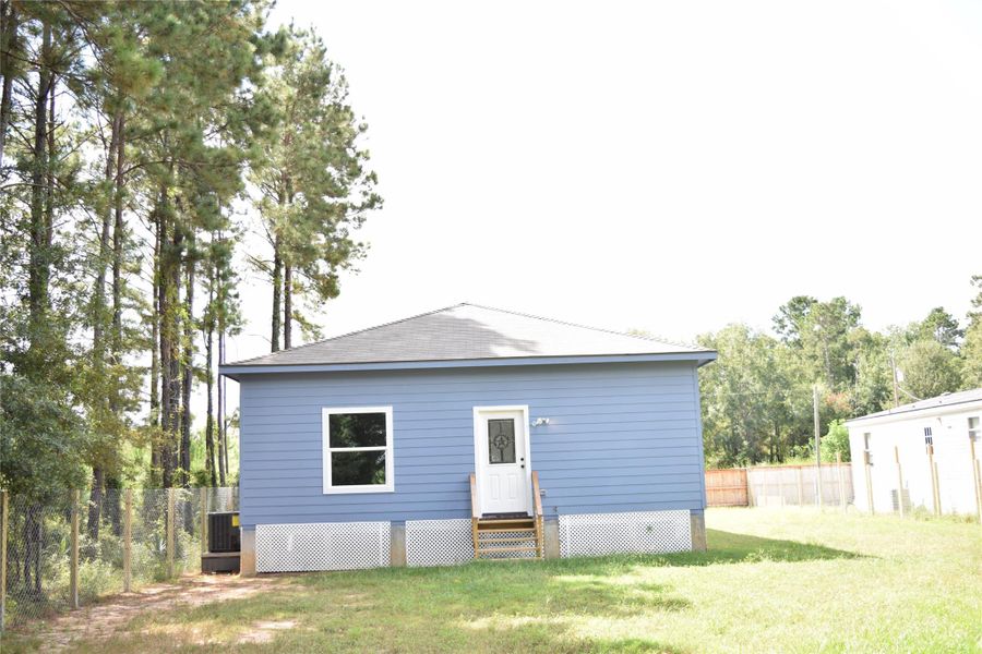 Front exterior of a new home in , Cleveland, TX, highlighting curb appeal (Image 15).