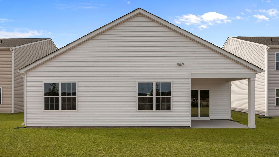 Exterior details and patio area of a home in Ridgewood Farms, Winterville (Image 22).