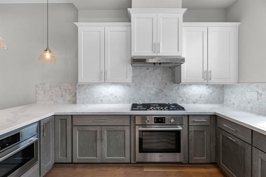 This elegant kitchen is truly a chef's dream, designed with both style and functionality in mind. The soft-close cabinets and drawers add a touch of luxury, ensuring that every element operates smoothly and quietly.