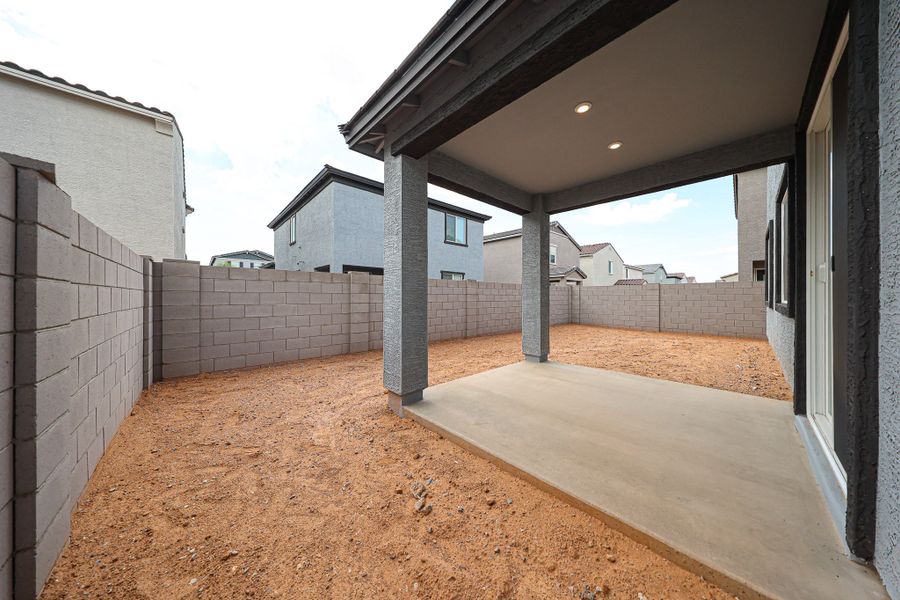 A dirt path between buildings.