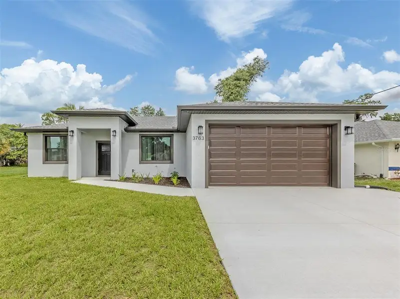 Front exterior of a new home in , North Port, FL, highlighting curb appeal (Image 2).