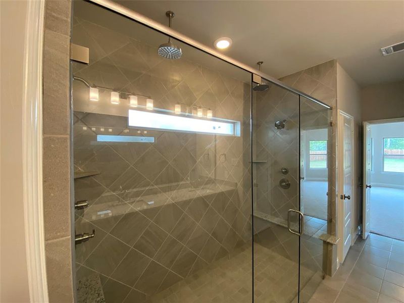 HUGE walk-in master shower with 2 shower heads & 2 rain heads. 4 shower heads total!