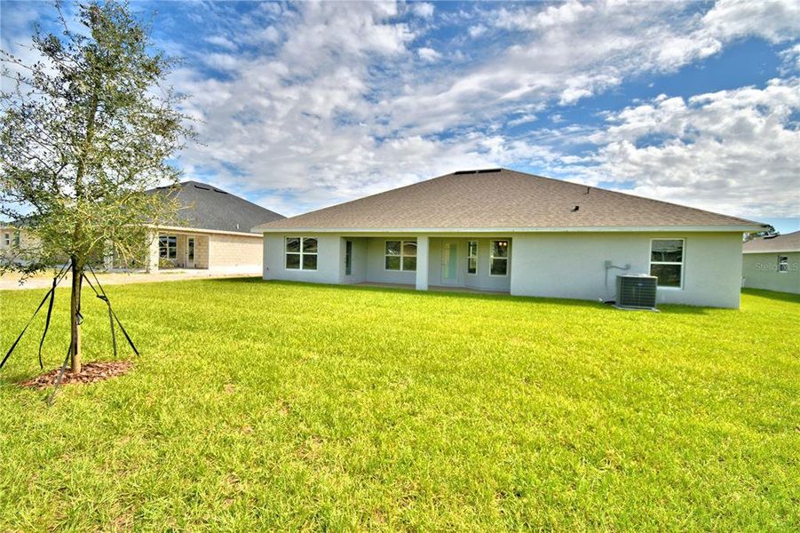 Exterior details and patio area of a home in Cadence Crossing, Auburndale (Image 28).