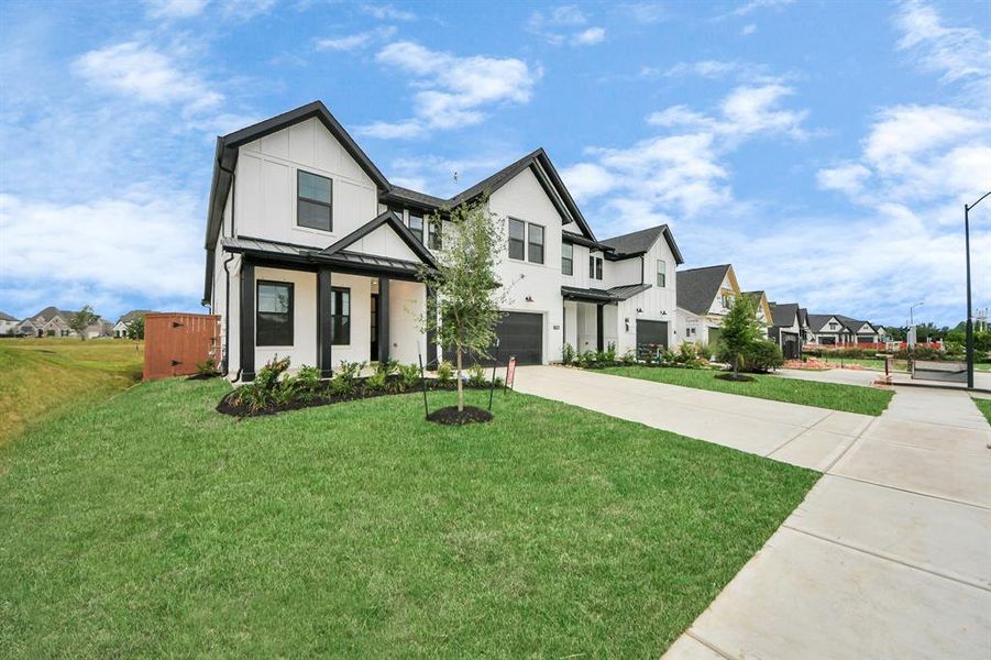 Front exterior of a new home in Elyson: Elyson Duets, Katy, TX, highlighting curb appeal (Image 2). Front exterior of a new home in Elyson: Elyson Duets, Katy, TX, highlighting curb appeal (Image 2).