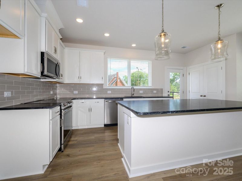 Furnished interior view inside a new home in Central Living at Craig, Charlotte (Image 7).