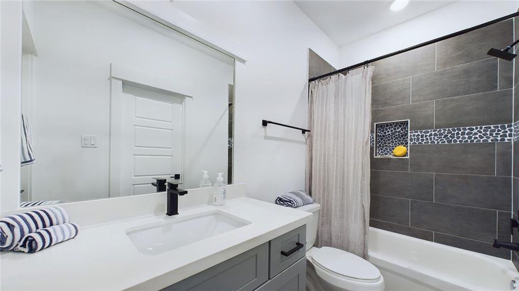 Jack & Jill bathroom for the secondary bedrooms - with Quartz vanity.