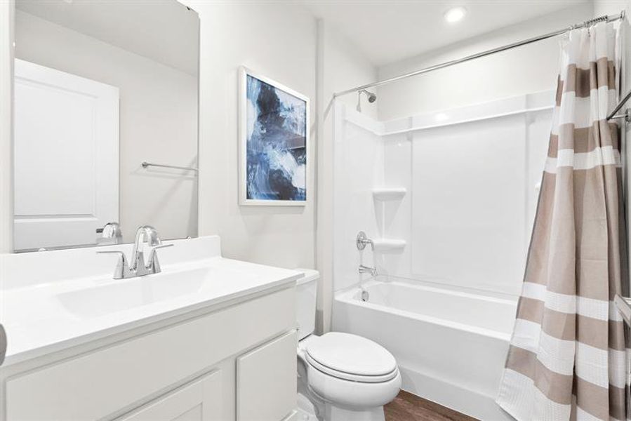 Representative furnished interior of a home built from the Ellis by Ryan Homes in Middle Creek Village Coastal Cottages & Villas, Bolivia (Image 23).