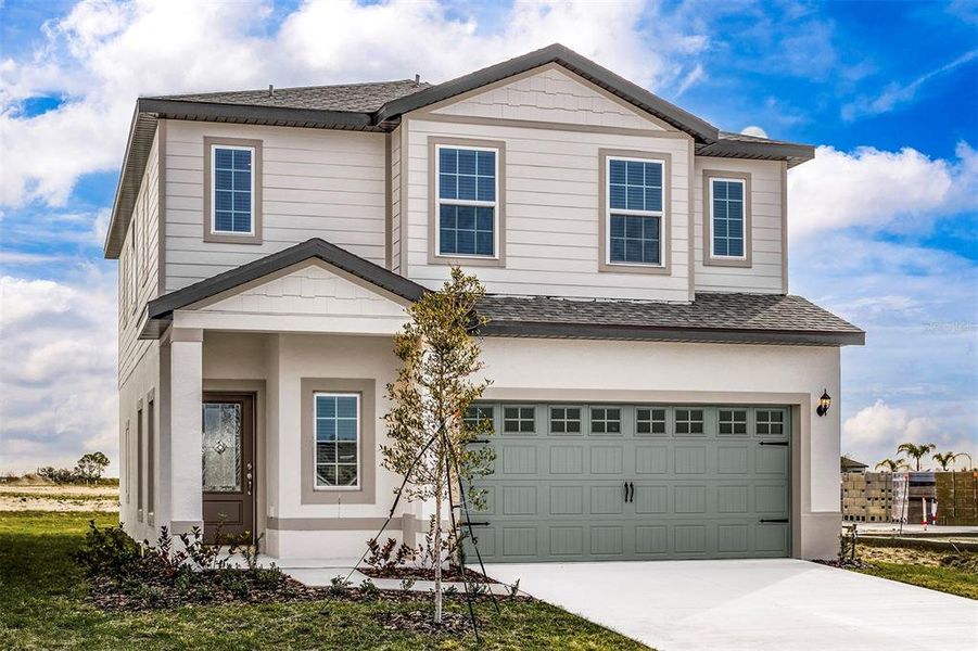 Front exterior of a new home in Gum Lake Preserve, Lake Alfred, FL, highlighting curb appeal (Image 1). Front exterior of a new home in Gum Lake Preserve, Lake Alfred, FL, highlighting curb appeal (Image 1).