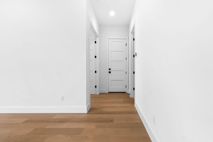Hallway featuring light hardwood / wood-style floors Hallway featuring light hardwood / wood-style floors