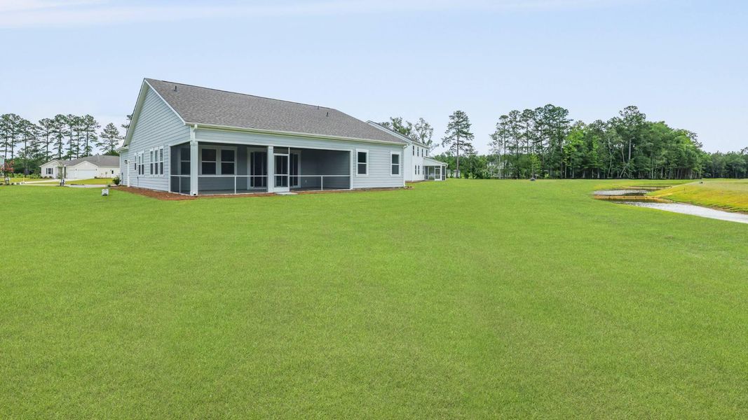 Front exterior of a new home in Berkeley Bay, Ridgeville, SC, highlighting curb appeal (Image 21).