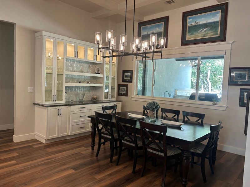 Dining room with beamed ceiling, a chandelier Dining room with beamed ceiling, a chandelier