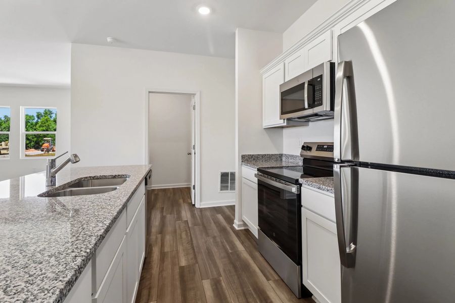 Representative furnished interior of a home built from the Larissa by Starlight Homes in Crescent Pointe, Carrollton (Image 11).