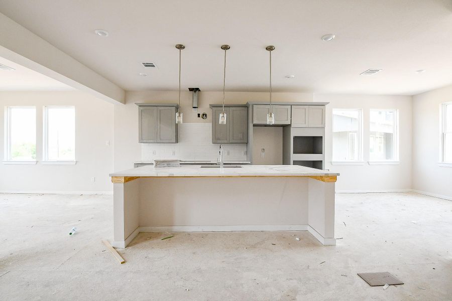 Notice the gorgeous gray cabinetry and a space for seating at the island. Notice the gorgeous gray cabinetry and a space for seating at the island.