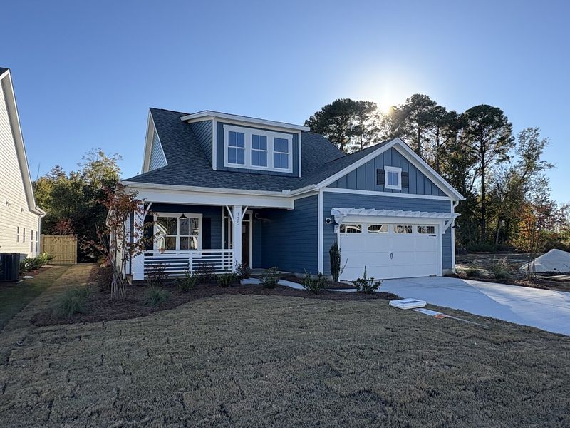 Front exterior of a new home in Riverside Cove, Wilmington, NC, highlighting curb appeal (Image 22).