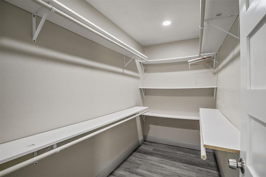 Walk in closet featuring light wood-style flooring