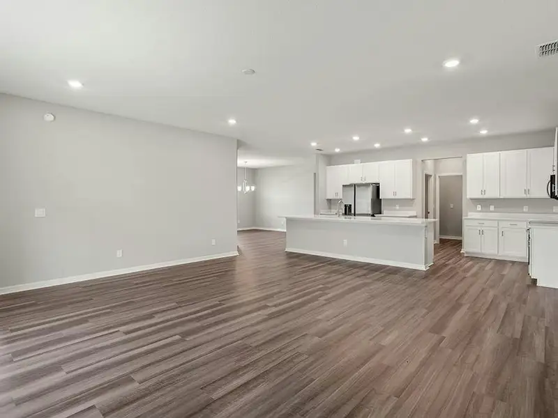 This home features a sunny, open living area with LVP flooring.