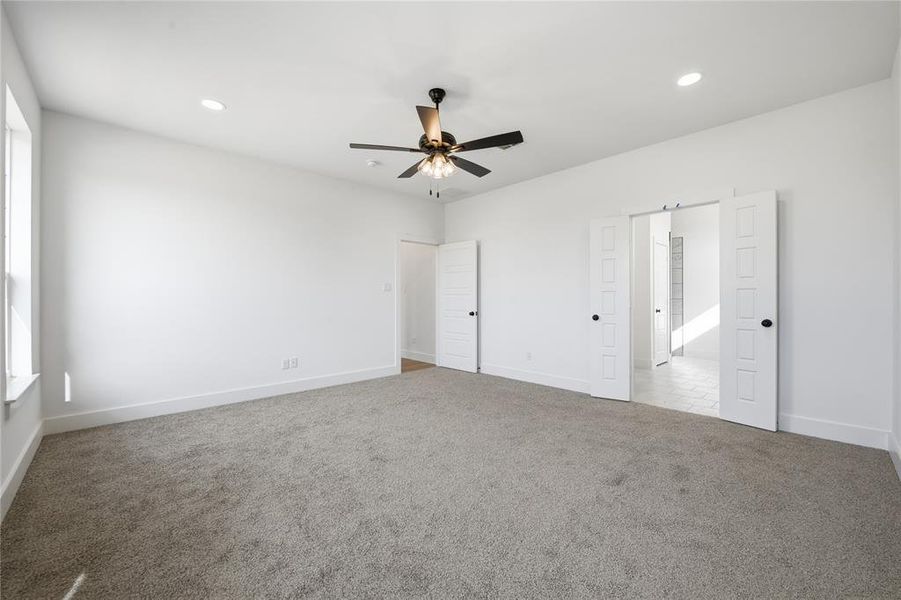 Unfurnished bedroom featuring carpet floors, recessed lighting, and a ceiling fan Unfurnished bedroom featuring carpet floors, recessed lighting, and a ceiling fan