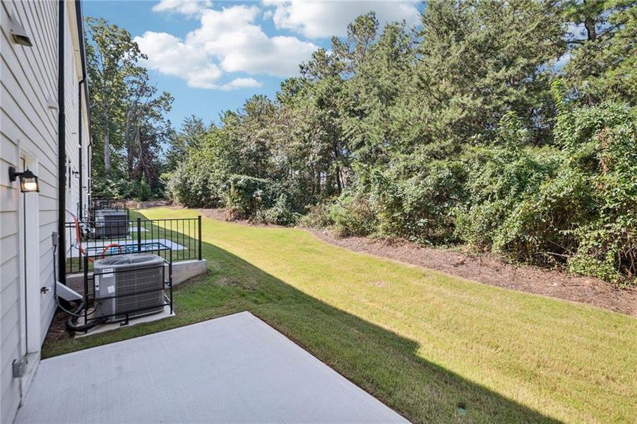 Exterior details and patio area of a home in Artisan Walk, Fairburn (Image 29).