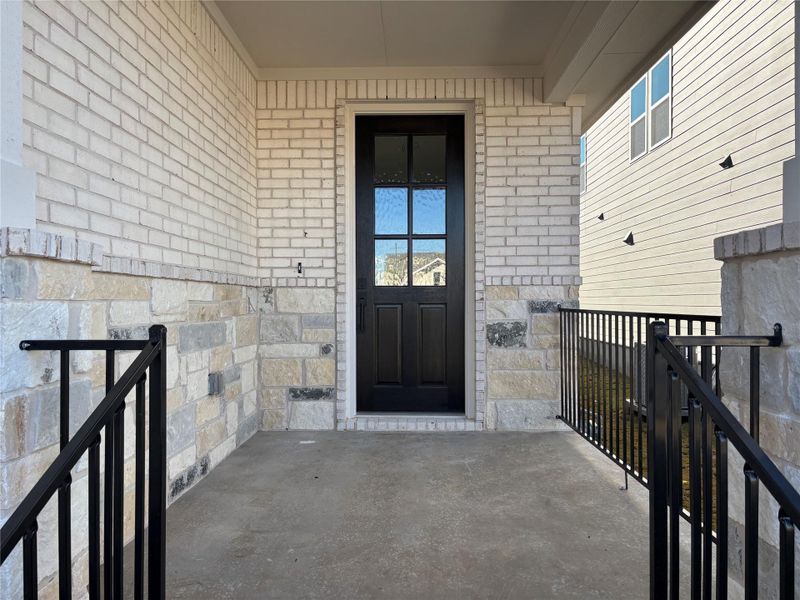 Exterior details and patio area of a home in Cannon Ranch 40s, Dripping Springs (Image 3).