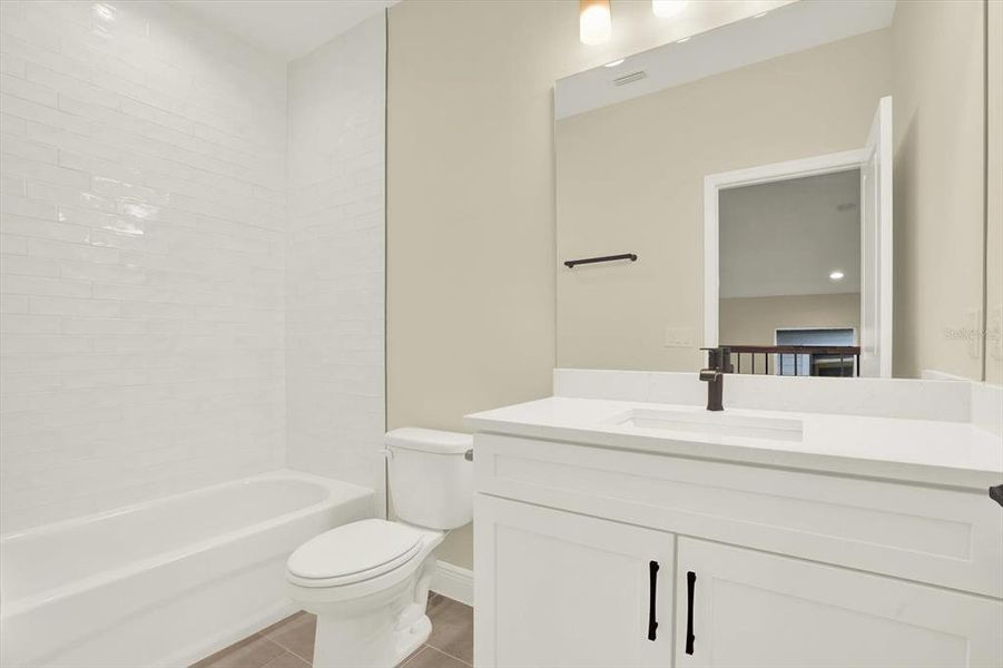 Furnished interior view inside a new home in The Towns At Long Bayou, Seminole (Image 10).