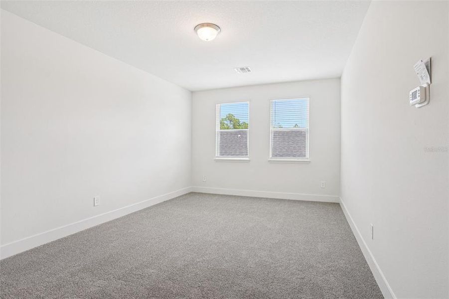 Spacious, unfurnished interior of a new home in Ridgehaven - Signature Series, Ormond Beach (Image 33).