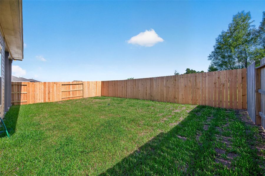 Exterior details and patio area of a home in Mostyn Springs, Magnolia (Image 23).